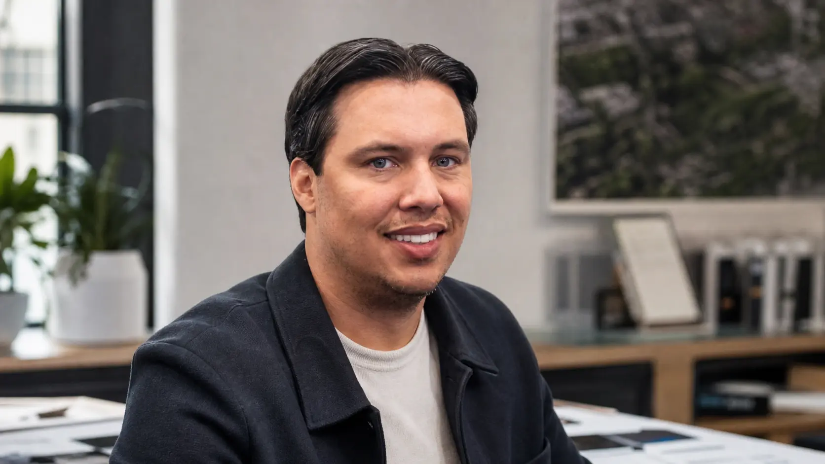Photorealistic editorial portrait of Abdiel Marin in a restrained ophthalmology-software workspace.