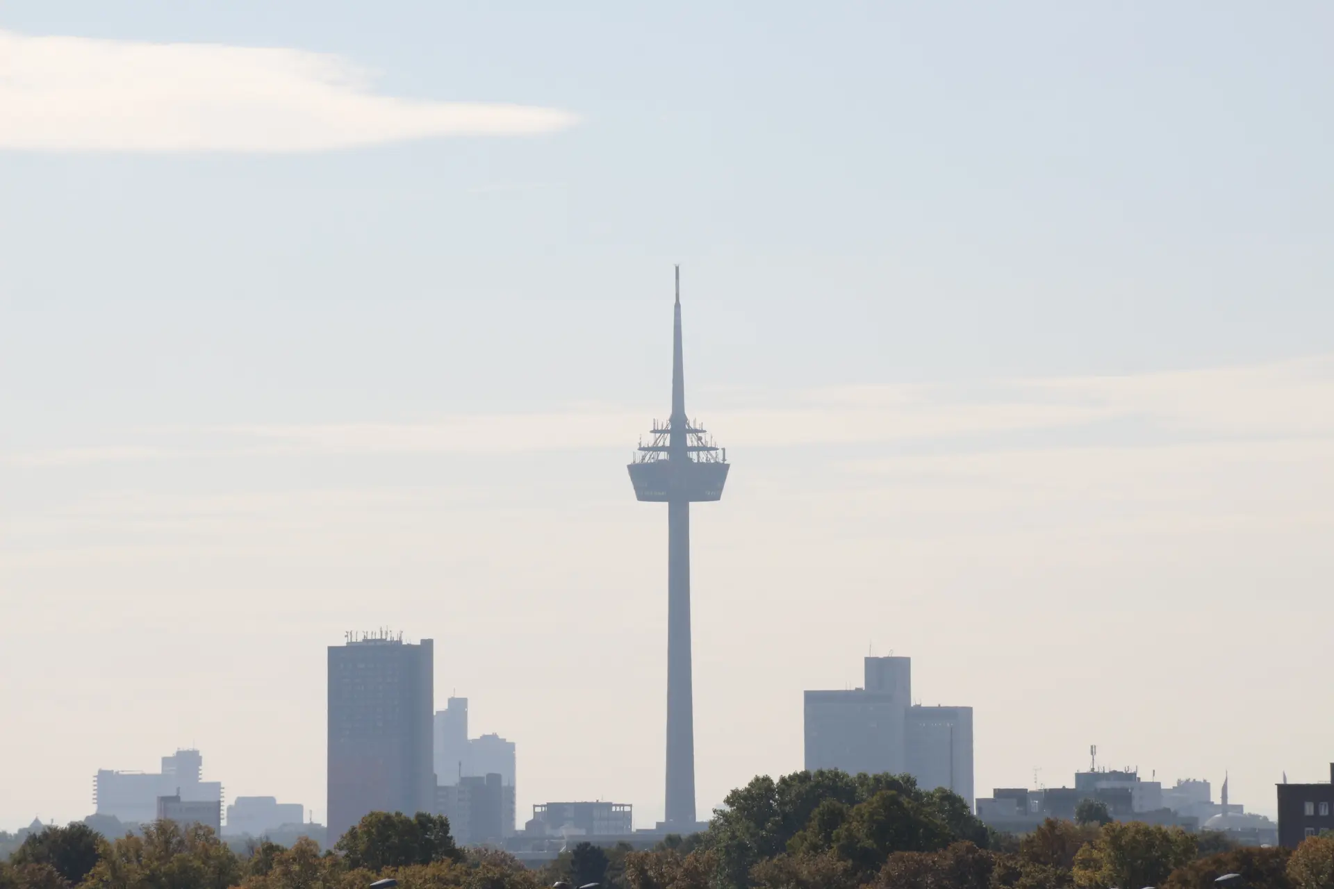 Cologne skyline with the Colonius telecommunications tower under a blue sky.