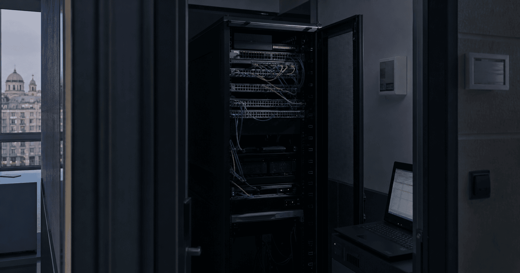 A network equipment room with inactive devices, monitoring dashboard showing AS210350 status with no route announcements.