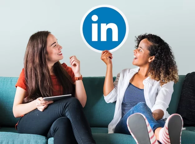 Two-people-sitting-on-a-coach-LinkedIn-logo-on-the-foreground.